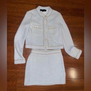 Brand new with tags two piece light blue jacket and skirt.